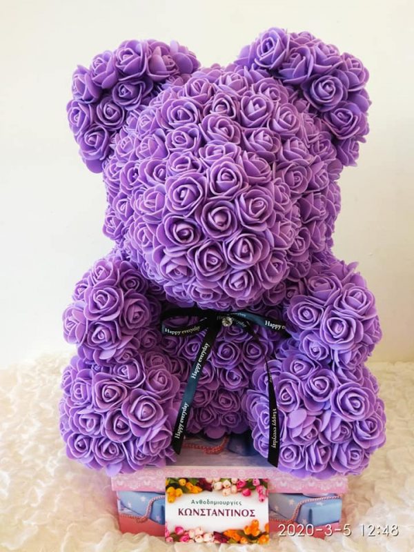 teddy bear with purple roses