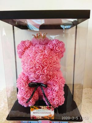 pink teddy bear with roses