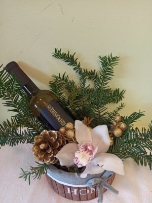 Basket with fir and orchid wine